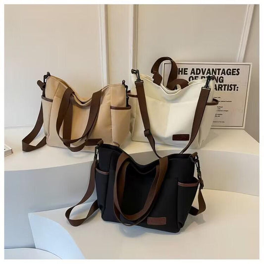 Spacious water proof bag
Can fit A4, laptop, diaper bag