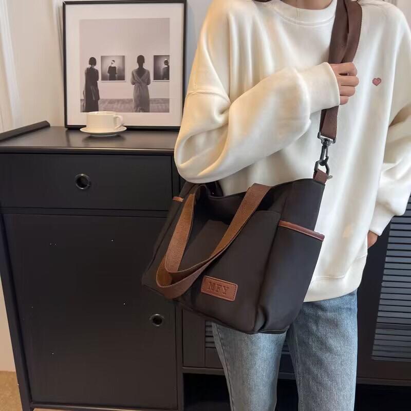 Spacious water proof bag
Can fit A4, laptop, diaper bag