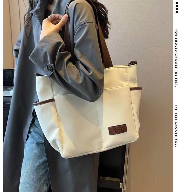 Spacious water proof bag
Can fit A4, laptop, diaper bag